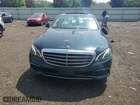 2017 Mercedes-Benz E 300 Luxury with VIN WDDZF4KBXHA185598, listed as a Copart auction lot 61011935 with 59,116 mi miles and Salvage title. Bid and sale history available at DreamBid. Image 13.