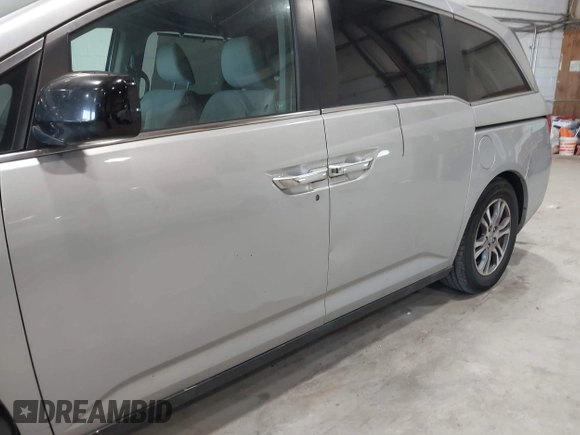 2012 Honda Odyssey EX z VIN 5FNRL5H47CB045705, wystawiony jako IAAI lot #42384430 z przebiegiem 157 598 mil mil oraz . Historia ofert i sprzedaży dostępna na DreamBid. Obrazek 19.