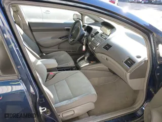 2009 Honda Civic Sdn LX with VIN 2HGFA16559H544472, listed as a IAAI auction lot 41695513 with 124,845 mi miles. Bid and sale history available at carsss.com. Image 5.