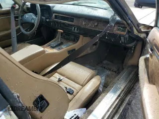 1989 Jaguar XJS z VIN SAJNY584XKC161154, wystawiony jako Copart lot #70912984 z przebiegiem 65 188 mil mil oraz Czysty tytuł • Clean title. Historia ofert i sprzedaży dostępna na DreamBid. Obrazek 8.