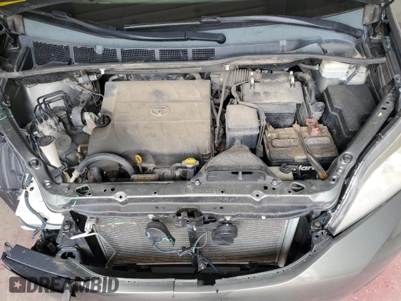 2012 Toyota Sienna XLE AAS с VIN 5TDYK3DCXCS202381, выставлен на аукционе Copart как лот 59002895 с пробегом 272 415 миль миль и Списание • Salvage title. История ставок и продаж доступна на DreamBid. Изображение 12.