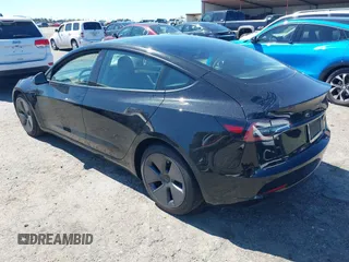 2022 Tesla Model 3 Long Range with VIN 5YJ3E1EB3NF104313, listed as a IAAI auction lot 41832803 with 39,061 mi miles and . Bid and sale history available at DreamBid. Image 3.