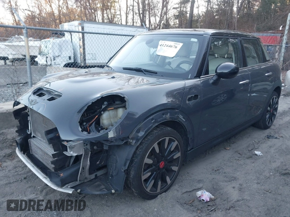 2016 MINI Cooper Hardtop 4 Door S with VIN WMWXU3C56G2B63682, listed as a IAAI auction lot 41244676 with 110,902 mi miles. Bid and sale history available at carsss.com. Image 2.