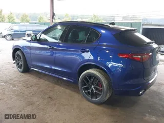 2021 Alfa Romeo Stelvio Ti with VIN ZASPAKBN4M7D21284, listed as a IAAI auction lot 40573443 with 26,230 mi miles. Bid and sale history available at carsss.com. Image 3.