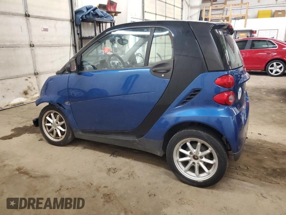 2009 Smart fortwo Pure z VIN WMEEJ31X99K209790, wystawiony jako Copart lot #51102685 z przebiegiem 30 389 mil mil oraz Szkody całkowita. Historia ofert i sprzedaży dostępna na DreamBid. Obrazek 2.