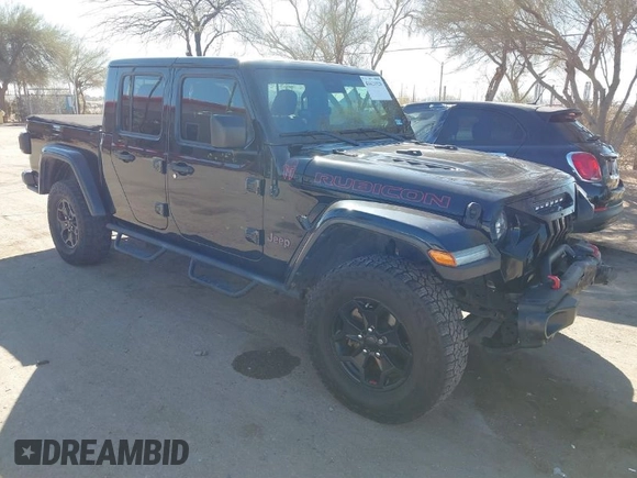 2020 Jeep Gladiator Rubicon z VIN 1C6JJTBG0LL117908, wystawiony jako IAAI lot #41621920 z przebiegiem 61 233 mil mil oraz . Historia ofert i sprzedaży dostępna na DreamBid. Obrazek 1.