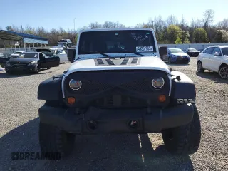 2012 Jeep Wrangler Unlimited Sport with VIN 1C4BJWDG2CL257437, listed as a Copart auction lot 49257965 with 141,695 mi miles and Clean title. Bid and sale history available at DreamBid. Image 5.