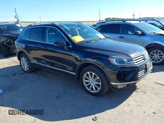 2016 Volkswagen Touareg Sport with VIN WVGEF9BP4GD012265, listed as a IAAI auction lot 41208383 with 69,205 mi miles and . Bid and sale history available at DreamBid. Image 1.