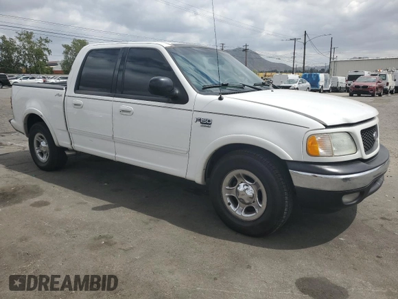 2002 Ford F-150 XLT with VIN 1FTRW07L52KA04929, listed as a Copart auction lot 54491815 with 169,132 mi miles and Salvage Title. Bid and sale history available at carsss.com. Image 4.