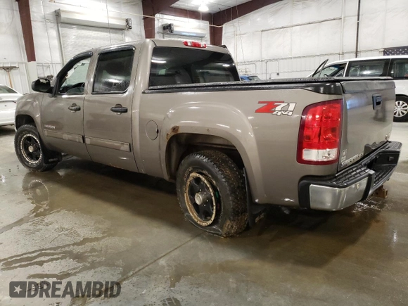 2012 GMC Sierra 1500 SLE with VIN 3GTP2VE73CG227453, listed as a Copart auction lot 52871865 with 133,419 mi miles and Salvage Title. Bid and sale history available at DreamBid. Image 2.