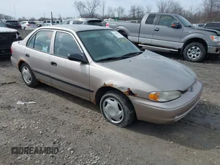 1999 Chevrolet Prizm with VIN 1Y1SK5488XZ446950, listed as a IAAI auction lot 41798129 with 292,798 mi miles. Bid and sale history available at carsss.com. Image 1.