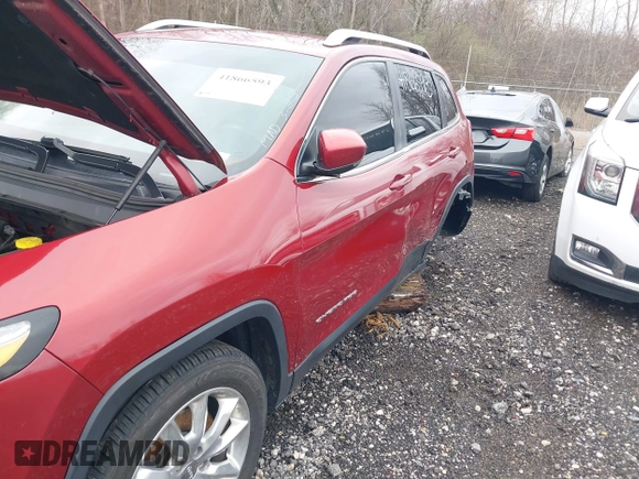 2015 Jeep Cherokee Limited with VIN 1C4PJLDB8FW732892, listed as a IAAI auction lot 41866593 with 153,477 mi miles and . Bid and sale history available at DreamBid. Image 6.