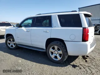 2015 Chevrolet Tahoe LTZ with VIN 1GNSKCKC9FR666040, listed as a Copart auction lot 44431875 with 233,166 mi miles and Salvage Title. Bid and sale history available at carsss.com. Image 2.