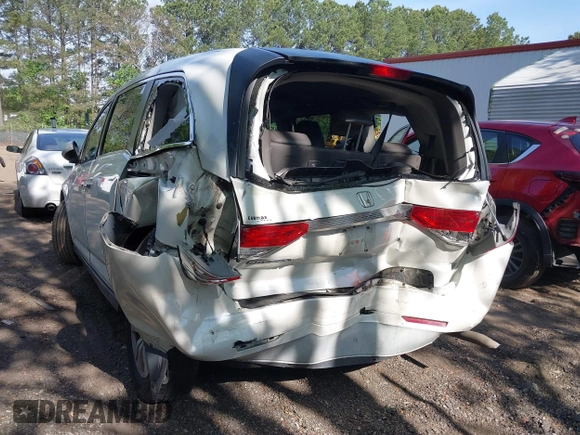 2014 Honda Odyssey EX-L with VIN 5FNRL5H63EB064854, listed as a IAAI auction lot 42102704 with 148,536 mi miles and . Bid and sale history available at carsss.com. Image 6.