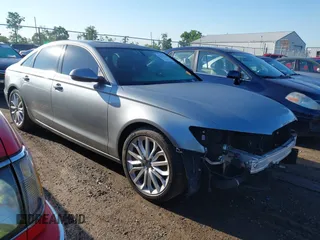 2013 Audi A6 Premium Plus with VIN WAUGFAFC7DN145322, listed as a IAAI auction lot 42615532 with 148,163 mi miles and . Bid and sale history available at DreamBid. Image 1.
