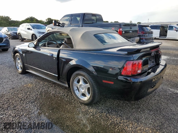 2004 Ford Mustang Deluxe with VIN 1FAFP44414F125267, listed as a Copart auction lot 74595714 with 0 mi miles and Salvage Title. Bid and sale history available at carsss.com. Image 2.