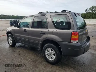 2006 Ford Escape XLS with VIN 1FMYU02Z66KA18952, listed as a Copart auction lot 60472305 with 221,258 mi miles and Salvage title. Bid and sale history available at DreamBid. Image 2.