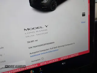 2023 Tesla Model Y Long Range with VIN 7SAYGDEE2PF808844, listed as a IAAI auction lot 41941905 with 39,951 mi miles and . Bid and sale history available at carsss.com. Image 7.