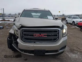2015 GMC Yukon SLT z VIN 1GKS2BKC6FR655777, wystawiony jako IAAI lot #40982330 z przebiegiem 120 627 mil mil oraz . Historia ofert i sprzedaży dostępna na DreamBid. Obrazek 6.