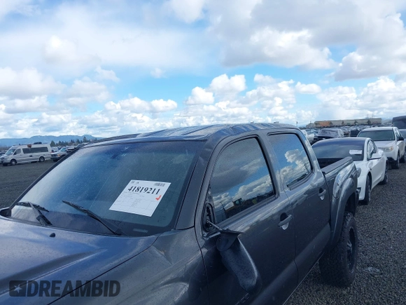 2013 Toyota Tacoma with VIN 3TMLU4ENXDM105967, listed as a IAAI auction lot 41819211 with 121,012 mi miles and . Bid and sale history available at DreamBid. Image 6.