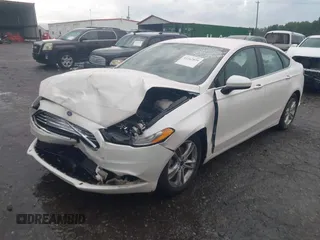 2018 Ford Fusion SE z VIN 3FA6P0H75JR159448, wystawiony jako IAAI lot #42262839 z przebiegiem 144 353 mil mil oraz . Historia ofert i sprzedaży dostępna na DreamBid. Obrazek 2.