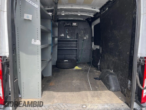 2021 Ford Transit Cargo with VIN 1FTBR1C87MKA51303, listed as a IAAI auction lot 42155119 with 49,578 mi miles and . Bid and sale history available at DreamBid. Image 1.