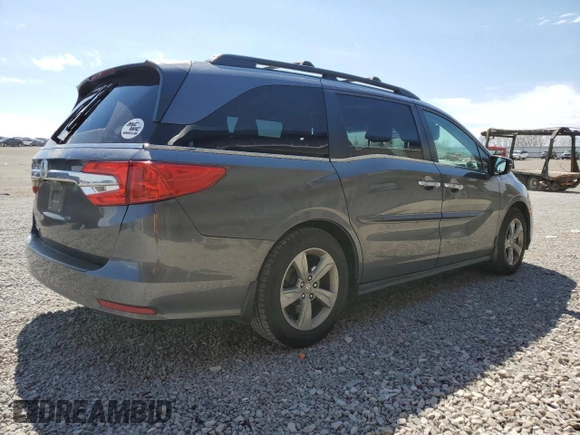 2018 Honda Odyssey EX-L z VIN 5FNRL6H70JB000036, wystawiony jako Copart lot #50455365 z przebiegiem 141 010 mil mil oraz Szkoda całkowita • Salvage title. Historia ofert i sprzedaży dostępna na DreamBid. Obrazek 3.