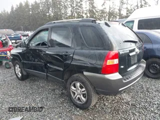 2005 Kia Sportage LX with VIN KNDJF723557054234, listed as a IAAI auction lot 40652851 with 220,215 mi miles and . Bid and sale history available at carsss.com. Image 3.