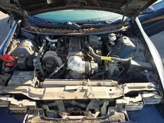 1996 Chevrolet Camaro Z28 z VIN 2G1FP32PXT2166409, wystawiony jako IAAI lot #41264761 z przebiegiem 143 820 mil mil oraz . Historia ofert i sprzedaży dostępna na DreamBid. Obrazek 10.