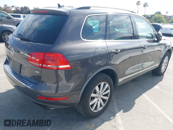2011 Volkswagen Touareg Sport with VIN WVGFF9BP3BD002517, listed as a IAAI auction lot 42174143 with 156,337 mi miles and . Bid and sale history available at DreamBid. Image 4.