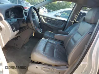 2004 Honda Odyssey EX-L with VIN 5FNRL18044B069774, listed as a Copart auction lot 57096535 with 165,307 mi miles and Salvage title. Bid and sale history available at DreamBid. Image 7.