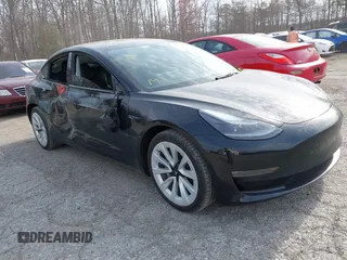 2022 Tesla Model 3 Long Range with VIN 5YJ3E1EB6NF343869, listed as a IAAI auction lot 41826077 with 36,643 mi miles. Bid and sale history available at carsss.com. Image 1.
