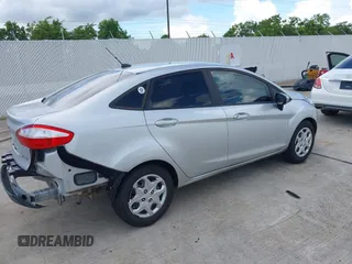 2014 Ford Fiesta S with VIN 3FADP4AJ6EM211807, listed as a IAAI auction lot 42601443 with 163,459 mi miles and . Bid and sale history available at DreamBid. Image 4.