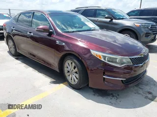 2016 Kia Optima EX z VIN 5XXGU4L35GG005896, wystawiony jako IAAI lot #42505052 z przebiegiem 144 936 mil mil oraz . Historia ofert i sprzedaży dostępna na DreamBid. Obrazek 1.