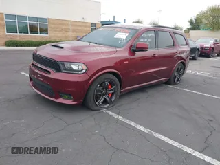 2018 Dodge Durango SRT with VIN 1C4SDJGJ5JC291287, listed as a IAAI auction lot 41862178 with 70,294 mi miles and . Bid and sale history available at DreamBid. Image 2.