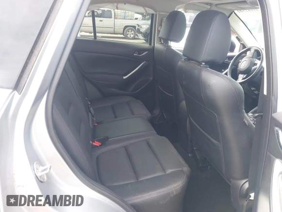 2016 Mazda CX-5 Grand Touring with VIN JM3KE2DY9G0723921, listed as a IAAI auction lot 41681522 with 83,893 mi miles. Bid and sale history available at carsss.com. Image 8.