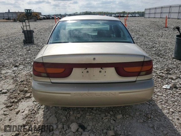 2001 Saturn SL z VIN 1G8ZK52741Z200069, wystawiony jako Copart lot #56360685 z przebiegiem 115 673 mil mil oraz Nie do naprawy. Historia ofert i sprzedaży dostępna na DreamBid. Obrazek 6.