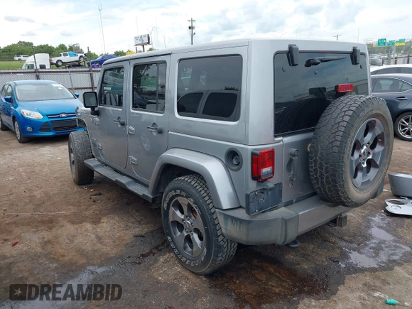 2016 Jeep Wrangler Unlimited Sahara z VIN 1C4BJWEGXGL280016, wystawiony jako IAAI lot #42620102 z przebiegiem 128 232 mil mil oraz . Historia ofert i sprzedaży dostępna na DreamBid. Obrazek 3.