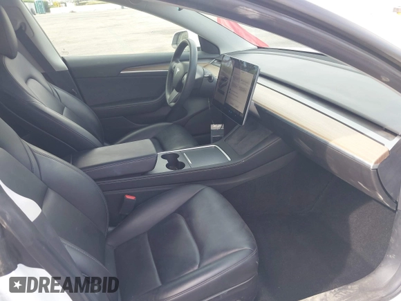 2021 Tesla Model 3 Long Range with VIN 5YJ3E1EB7MF089524, listed as a IAAI auction lot 42023474 with 19,757 mi miles and . Bid and sale history available at carsss.com. Image 5.