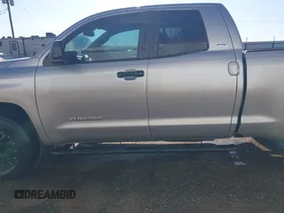 2014 Toyota Tundra SR with VIN 5TFRM5F13EX078411, listed as a IAAI auction lot 42702477 with 123,336 mi miles and . Bid and sale history available at DreamBid. Image 14.