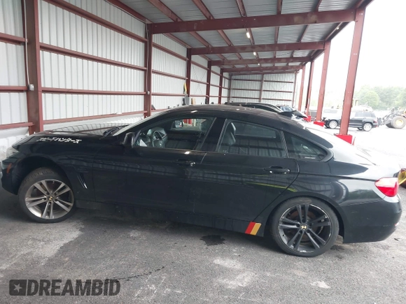 2015 BMW 4 Series 428i xDrive with VIN WBA4C9C57FD331872, listed as a IAAI auction lot 42276675 with 106,543 mi miles and . Bid and sale history available at DreamBid. Image 14.