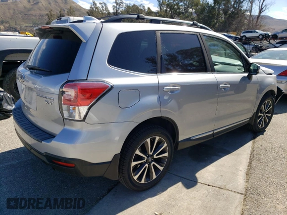 2018 Subaru Forester Touring with VIN JF2SJGWC5JH604342, listed as a Copart auction lot 45248095 with 57,417 mi miles and Salvage Title. Bid and sale history available at carsss.com. Image 3.
