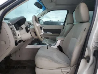 2009 Mercury Mariner with VIN 4M2CU81G49KJ16972, listed as a Copart auction lot 72354504 with 148,966 mi miles and Salvage title. Bid and sale history available at DreamBid. Image 7.