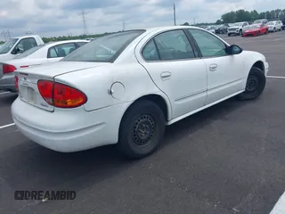 2002 Oldsmobile Alero GX z VIN 1G3NK52F22C188987, wystawiony jako IAAI lot #42240189 z przebiegiem 134 891 mil mil oraz . Historia ofert i sprzedaży dostępna na DreamBid. Obrazek 4.