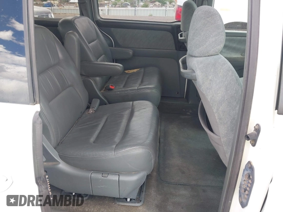 2001 Honda Odyssey EX z VIN 2HKRL18661H566973, wystawiony jako IAAI lot #42117015 z przebiegiem 206 999 mil mil oraz . Historia ofert i sprzedaży dostępna na DreamBid. Obrazek 8.