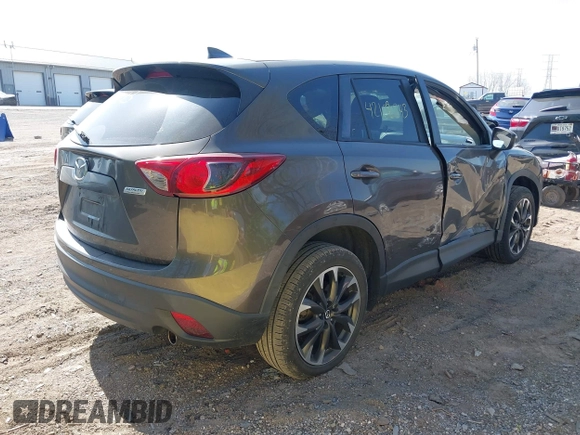 2016 Mazda CX-5 Grand Touring z VIN JM3KE4DY8G0846265, wystawiony jako IAAI lot #42102843 z przebiegiem 159 827 mil mil oraz . Historia ofert i sprzedaży dostępna na DreamBid. Obrazek 4.