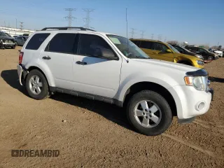 2009 Ford Escape XLS with VIN 1FMCU92729KD10213, listed as a Copart auction lot 48704425 with 114,219 mi miles and Salvage title. Bid and sale history available at DreamBid. Image 4.