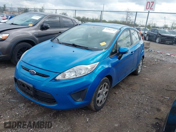 2013 Ford Fiesta SE with VIN 3FADP4EJ0DM158451, listed as a IAAI auction lot 42083743 with 111,919 mi miles. Bid and sale history available at carsss.com. Image 2.