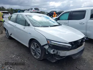 2018 Honda Clarity Touring z VIN JHMZC5F38JC001957, wystawiony jako IAAI lot #41773906 z przebiegiem 99 689 mil mil oraz . Historia ofert i sprzedaży dostępna na DreamBid. Obrazek 1.