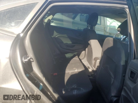 2018 Ford Fiesta SE z VIN 3FADP4BJ1JM115298, wystawiony jako Copart lot #76737564 z przebiegiem Nie podano mil oraz Szkoda całkowita • Salvage title. Historia ofert i sprzedaży dostępna na DreamBid. Obrazek 10.